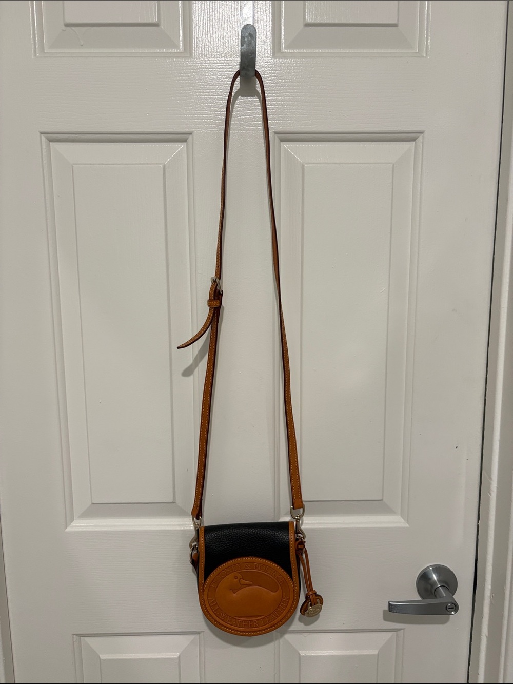 Dooney & Bourke Black and Brown Round Leather Crossbody